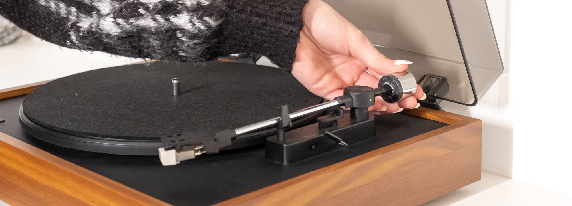Putting counterweight on tonearm of Montrose Vinyl Record Player